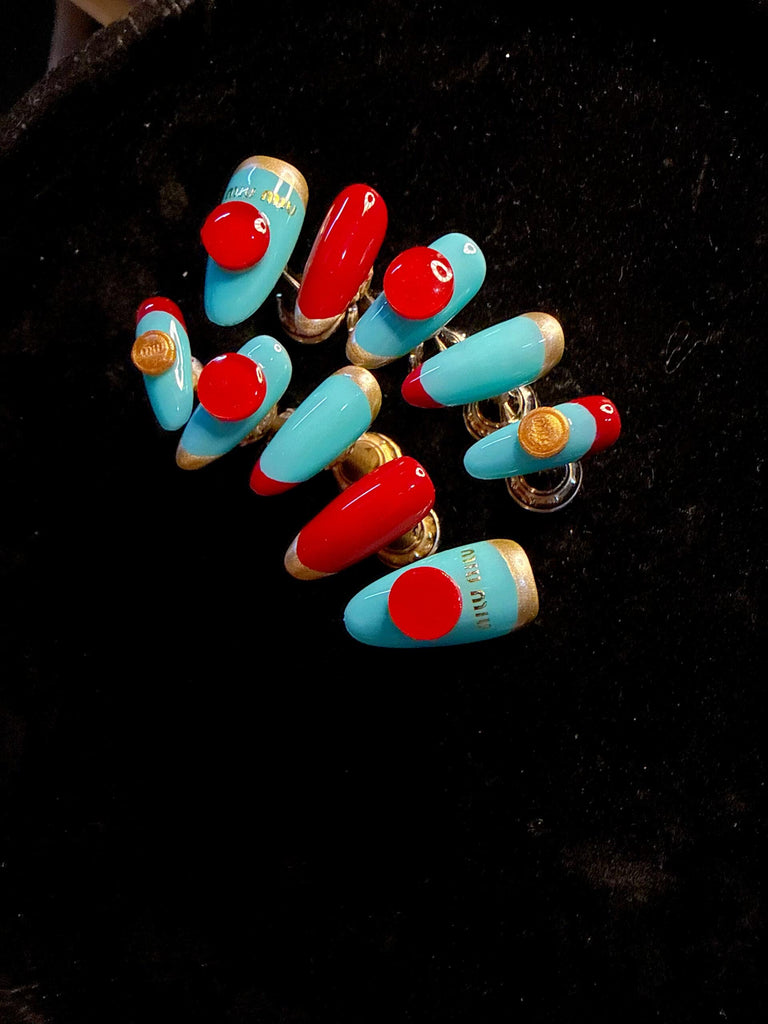 Pink Miumiu inspired glue on nails featuring luxury 3D charms, salon quality coffin fake nails.