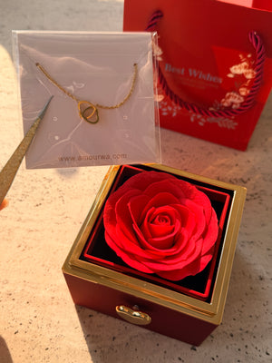 Red preserved rose jewelry gift box with a rotating golden heart clasp revealing a customized heart necklace inside.