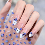 3D blueberry French tip nail stickers sheet and realistic fruit nail art application on a model's hands. Perfect DIY press-on gel nails featuring sweet textured blueberry decals, trendy white polka-dot French tips, and delicate bows for a summer coquette aesthetic.