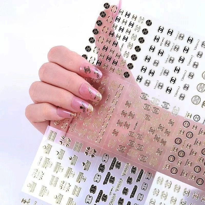 Gold luxury brand nail decals for acrylic nails, high quality waterproof designer nail art stickers.