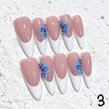 Amourwa luxury handmade 3D flower press-on nails display. Features elegant nude and white French tip nails decorated with textured 3D blue floral designs, glitter accents, and a trendy summer coquette aesthetic manicure.